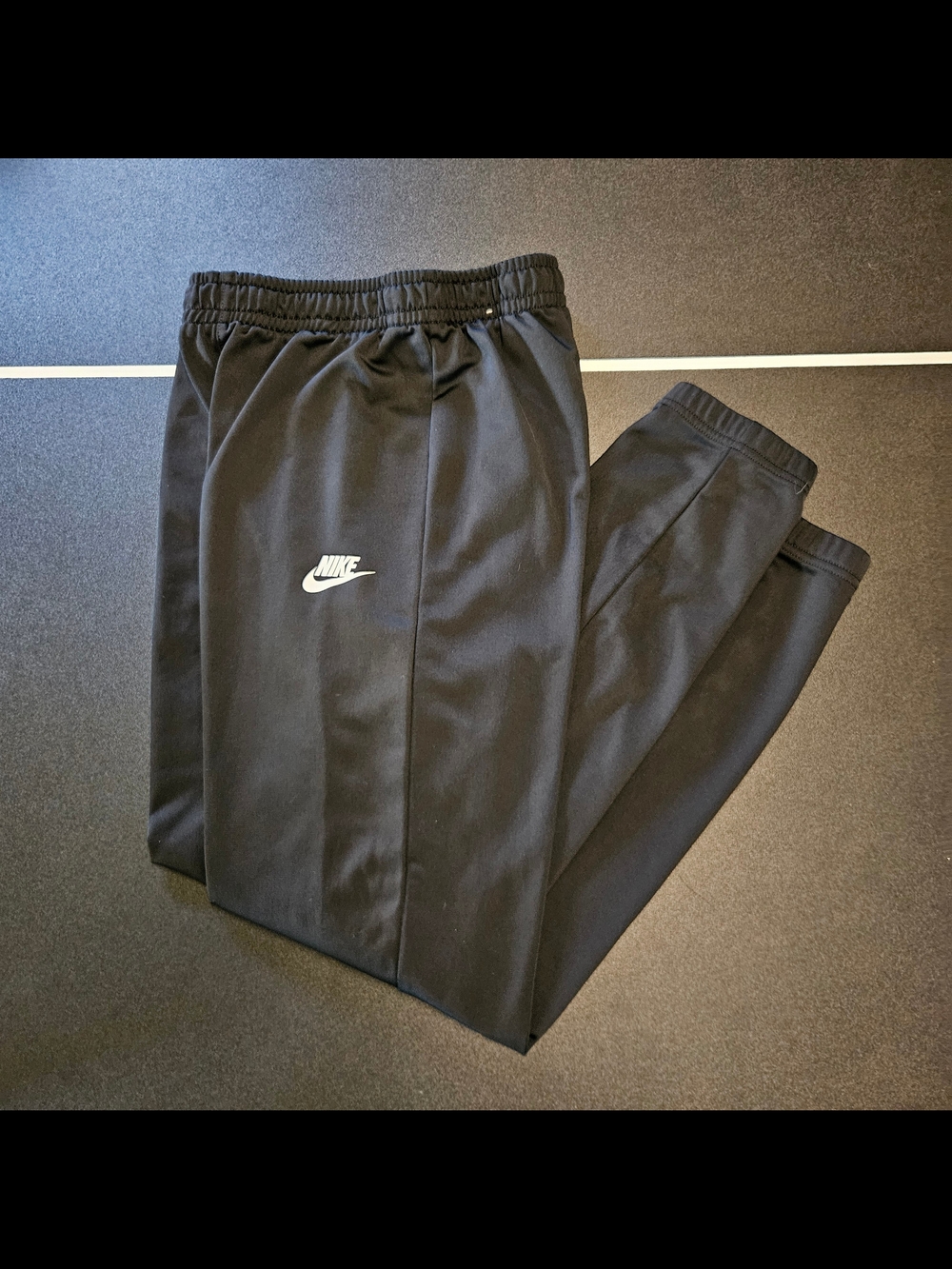 Nike Black Jogger Pants with White Swoosh Logo
